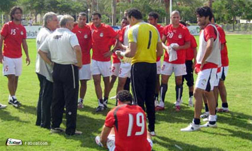 Shehata instructs his players during training